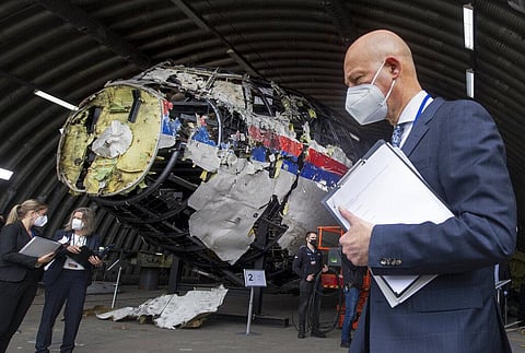 Presiding judge Hendrik Steenhuis views the reconstructed wreckage of Malaysia Airlines Flight MH17, at the Gilze-Rijen military airbase, Netherlands. (Photo | AP)