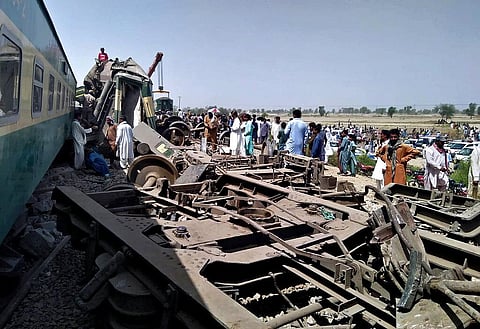 Soldiers and volunteers work at the site of a train collision in Ghotki district in Pakistan. (Photo | AP)