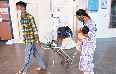A couple take an infant on oxygen support to Covid-19 ward in SVR Ruia Government General Hospital in Tirupati on Sunday | madhav k