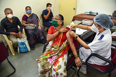 A health worker administers a dose of the COVID-19 vaccine at NMMC hospital, in Mumbai. (Photo | PTI)