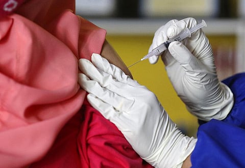 A woman receives a shot. (Photo | AP)