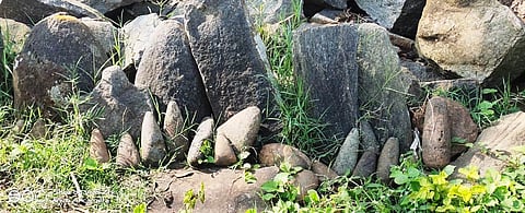 Several stones axes from the Neolithic period have been piled up outside temples and worshipped by tribals atop Jawadhu Hills in Tirupathur district (Photo | Special arrangement)