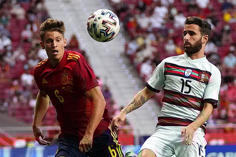 Spain's Marcos Llorente, left and Portugal's Rafa Silva chase the ball during the international friendly soccer match between Spain and Portugal. (Photo | AP)