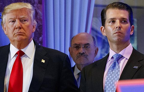 Donald Trump, left, his chief financial officer Allen Weisselberg, center, and his son Donald Trump Jr., right, during a news conference at Trump Tower (Photo | AP)