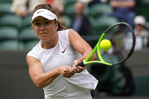 Ukraine's Elina Svitolina plays a return to Belgium's Alison Van Uytvanck during the women's singles first round match on day three of the Wimbledon Tennis Championships. (Photo | AP)