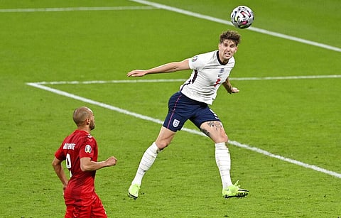 England's John Stones heads the ball during the Euro 2020 soccer championship semifinal between England and Denmark at Wembley stadium. (Photo | AP)