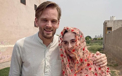 New Zealand YouTube vlogger Karl Edward Rice with Manisha Malik. (Photo | Twitter)