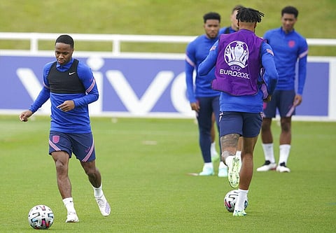 England's Raheem Sterling runs with the ball during a training session at St George's Park, Burton upon Trent. (Photo | AP)