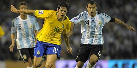 Brazil midfielder Kaka (L) vies for the ball with Argentina's Javier Mascherano during a FIFA World Cup South Africa-2010 qualifier football match. (File Photo | AFP)
