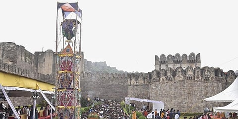 Devotees, flouting COVID-19 appropriate behaviour, participate in a procession near the Golconda Fort during the Ashada Bonalu festival, in Hyderabad. (Photo | PTI)