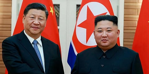 In this June 20, 2019, file photo provided by the North Korean government, North Korean leader Kim Jong Un, right, poses with Chinese President Xi Jinping in Pyongyang, North Korea. (File Photo | AP)