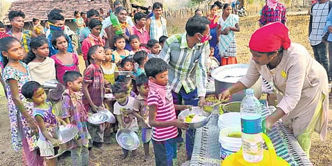 Taslima Mohammed distributes food to needy kids. (Photo| EPS)