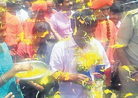 A file photo of Narayanaswamy being welcomed at Pemmanahalli hamlet