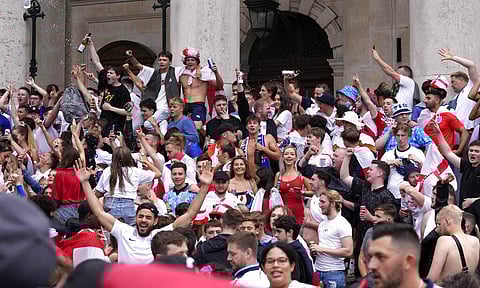 England fans cheer as they gather near Trafalgar Square in London, Sunday, July 11, 2021, prior to the Euro 2020 soccer championship final. (Photo | AP)