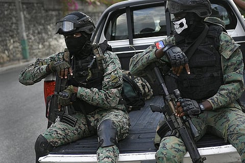 Soldiers stand guard near the residence of Interim President Claude Joseph in Port-au-Prince, Haiti, Sunday, July 11, 2021. (Photo | AP)
