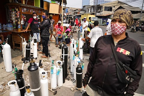 eople queue up to refill their oxygen tanks at a filling station in Jakarta, Indonesia. (Photo | AP)