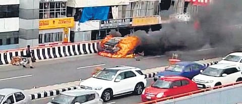 A screen grab of a burning car on PVNR Expressway in Hyderabad. (Photo| EPS)