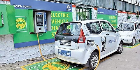 An electric vehicle replenishing charge at a charging station. (File photo | EPS)