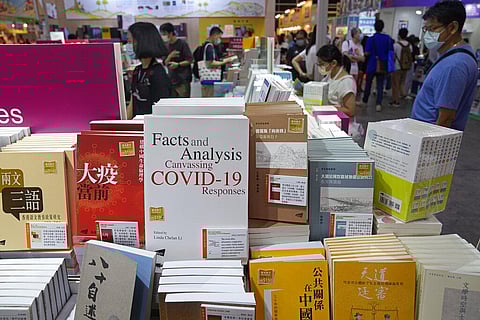 People browse through books at the annual book fair in Hong Kong. (Photo | AP)