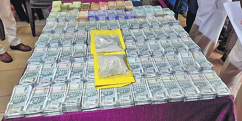 Cash and brown sugar seized by Saheed Nagar Police I Express