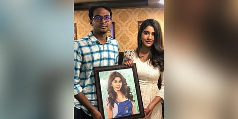 Ananth presenting his art to film actor Nabha Natesh