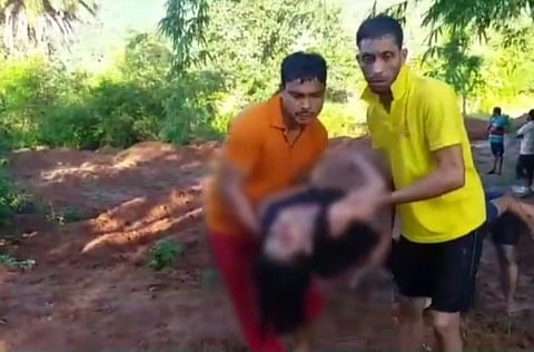 The fire service personnel rushing Bhagyalaxmi Patra to the hospital after her suicide bid. (Photo | EPS)