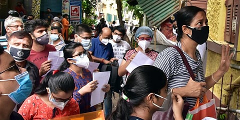 Candidates arrive to appear in the West Bengal Joint Entrance examination (WBJEE) outside a college, in Kolkata. (Photo | ANI)