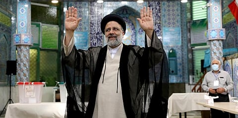 In this Friday, June 18, 2021 file photo, Ebrahim Raisi, a candidate in Iran's presidential elections waves to the media after casting his vote at a polling station in Tehran, Iran. (File photo | AP)