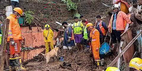 Firemen and rescue workers after a wall collapsed on some shanties in Chembur's Bharat Nagar area due to a landslide, in Mumbai. (Photo | PTI)