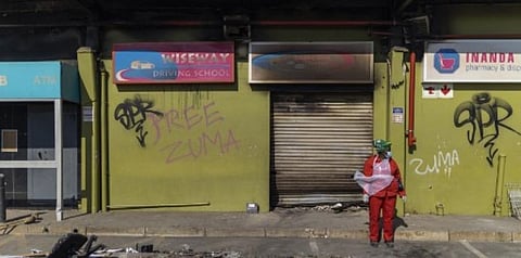 Residents in South Africa on Saturday cleaned up shops looted during a week of shocking violence that left more than 200 dead. (Photo | AFP)