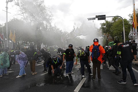 Police use water cannon to disperse protesters marching to Government House in Bangkok, Thailand Sunday, July 18, 2021. (Photo | AP)