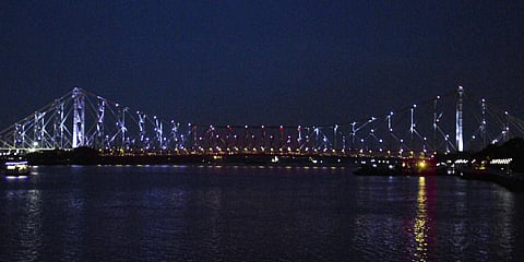 Howrah Bridge in Kolkata lights up in Olympic colours. (Photo| Twitter)