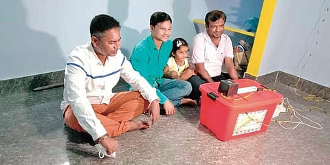 The researchers with the prototype paddy dryer machine. (Photo | EPS)