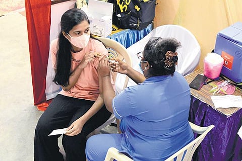 A health worker adminsters vaccine to people at the free vaccination camp conducted at Don Bosco School, Egmore, in Chennai. (Photo | EPS/Debadatta Mallick)