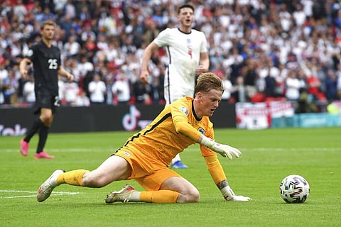 England's goalkeeper Jordan Pickford saves on Germany's Timo Werner during the Euro 2020 soccer championship round of 16 match between England and Germany. (Photo | AP)