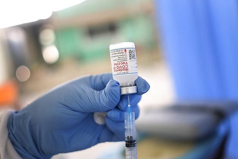 A healthcare worker prepares a dose of the Moderna COVID-19 vaccine at the Saint Damien Hospital, in Port-au-Prince, Haiti. (Photo | AP)