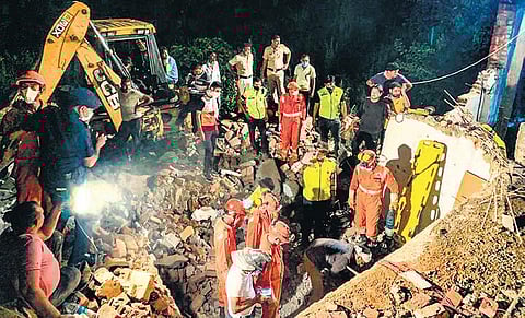 Rescue teams at work at Khawaspur village in Gurugram on Sunday night. (Photo | PTI)