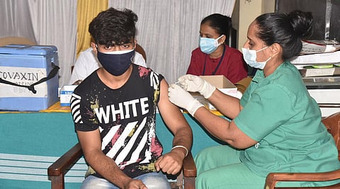 A student receives the Covid vaccine in Bengaluru on Saturday. (Photo |Nagaraja Gadekal, EPS)