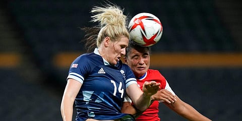 Britain's Millie Bright (14) and Chile's Maria Jose Urrutia fight for the ball during their match at the 2020 Summer Olympics, Wednesday, July 21, 2021, in Sapporo, Japan. (Photo | AP)