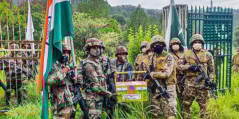 Indian & Pakistani Army exchange sweets on the occasion of Eid al-Adha at the Line of Control at Poonch-Rawalakot Crossing Point. (Photo | PTI)