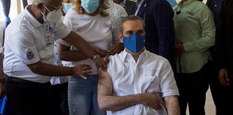 In this file photo, Dominican President Luis Abinader is vaccinated against Covid-19 at a vaccination centre in Santo Domingo, on June 4, 2021. (File photo | AFP)
