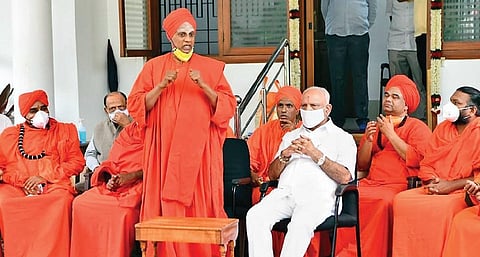 Siddalinga Swamy of Siddaganga Mutt, along with other seers, at a meeting with Chief Minister BS Yediyurappa in Bengaluru on Wednesday | VINOD KUMAR T
