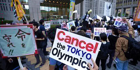 People against the opening of the Tokyo 2020 Olympics, gather to protest around the Tokyo Metropolitan Government building during a demonstration in Tokyo in June. (File Photo | AP)