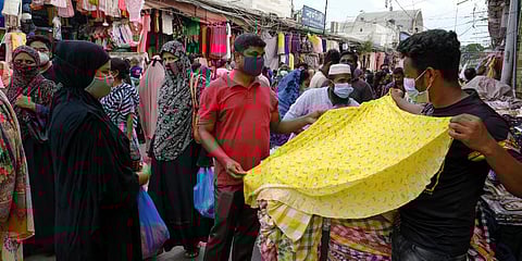 People shop at a market ahead of Eid-al Adha in Dhaka, Bangladesh. (Photo| AP)