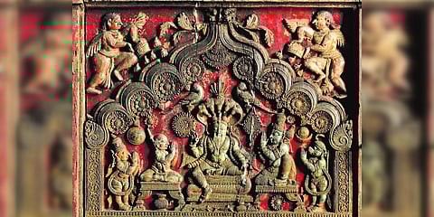 Wood relief carving of Vedavayasa flanked by Garuda, Madhwacharya, Bhimasena and Hanuman in the Chitra Mantapa of the Prasanna Venkatarama temple at Mysore. (Photo| EPS)