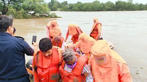 Rescue team evacuating people to safety (Photo | Express)