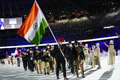 Mary Kom and Manpreet Singh carry the Indian flag during the opening ceremony in the Olympic Stadium at the 2020 Summer Olympics. (Photo | AP)