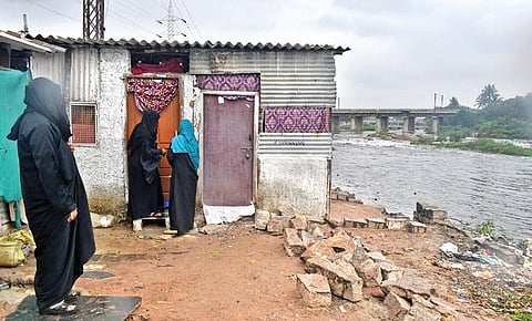 Residents of Chaderghat, Shankar Nagar and other neighbouring bastis on the banks of Musi move to safer grounds in Hyderabad on Friday (Photo | S Senbagapandiyan, EPS)