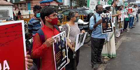 Activists form a human chain to protest against the death of Father Stan Swamy. (Photo| EPS)