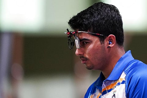 Chaudhary Saurabh, of India, pauses as he competes in the men's 10-meter air pistol at the Asaka Shooting Range in the 2020 Summer Olympics. (Photo | AP)
